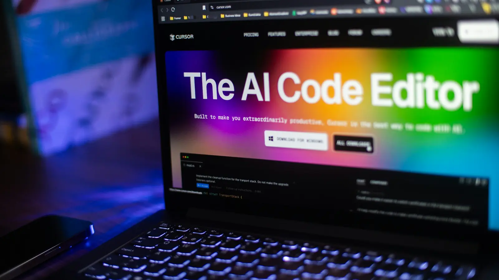 Laptop displays an artificial intelligence code editor on a colorful screen.